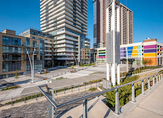 A modern cityscape with a mix of residential and commercial buildings.