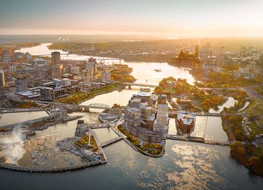 an aerial view of the city and the river