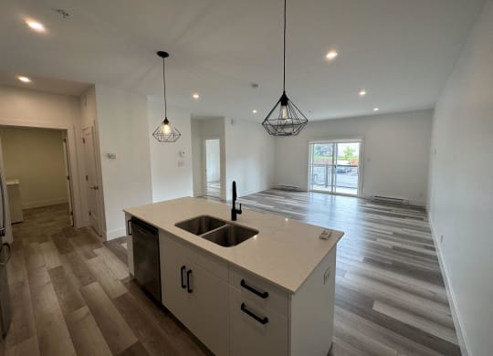 a kitchen and living room in a new home