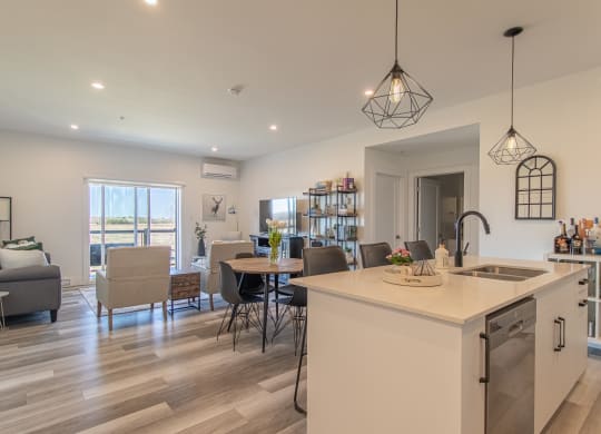 an open floor plan with a kitchen and living room