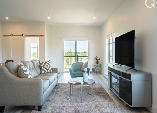 a living room with a couch and a television