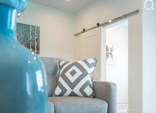 a cushion on a chair in a living room