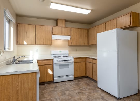 Modern Kitchen With White Cabinet at Meadowview Apartments, California