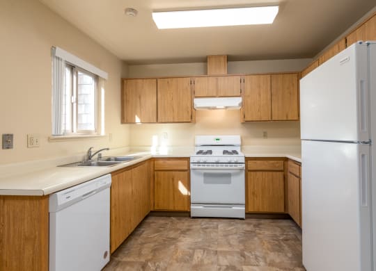 Modern Kitchen With Stainless Steel Appliances And Double Door Refrigerators at Meadowview Apartments, Santa Rosa