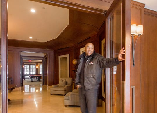 a man standing in a door way in a lobby at HIGHGROVE, Stamford, CT