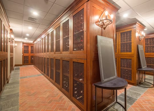 a large room filled with wooden cabinets and a large screen television at HIGHGROVE, Stamford, 06901