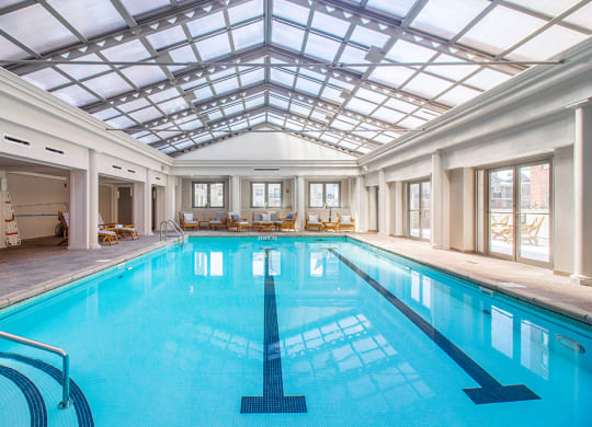 the indoor swimming pool is under a glass ceiling at HIGHGROVE, Stamford, CT, 06901