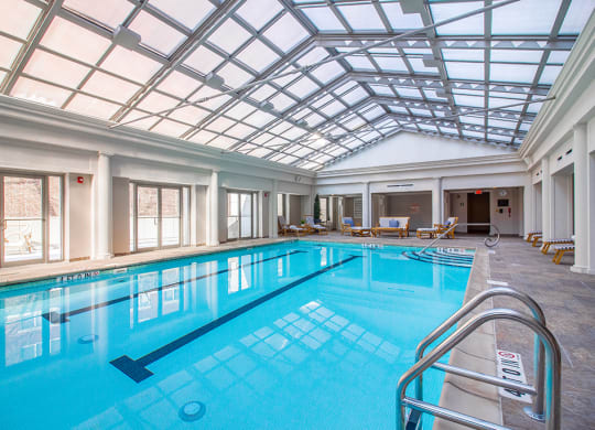 a swimming pool under a glass ceiling in a large room at HIGHGROVE, Connecticut