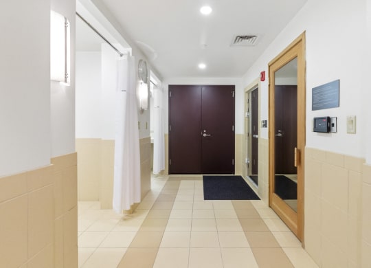 a corridor of a hospital with a door to a hallway of elevators  at HIGHGROVE, Connecticut