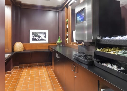 a kitchen with a counter and a tv in a hotel room at HIGHGROVE, Stamford, CT