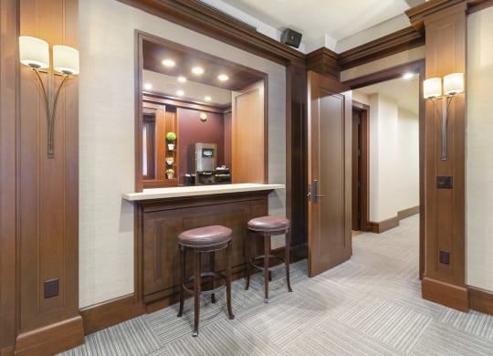 a small bar in a room with two doors and two stools at HIGHGROVE, Connecticut