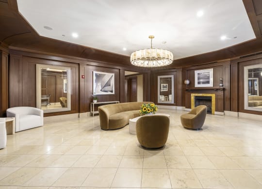 a living room with couches and chairs and a fireplace at HIGHGROVE, Stamford, CT