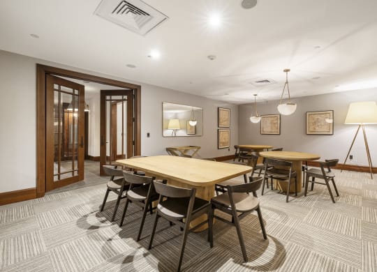 a dining room with a wooden table and chairs at HIGHGROVE, Stamford, 06901