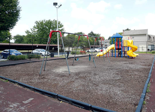 a playground with a slide and monkey bars