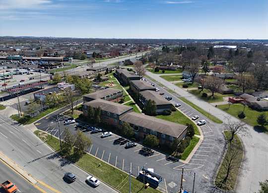 an aerial view of a neighborhood with houses and cars on the street