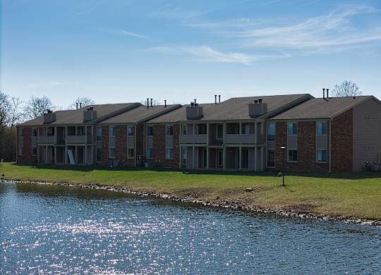 an apartment building overlooking a body of water
