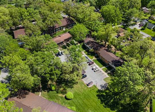 an aerial view of a neighborhood of houses and trees