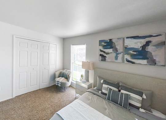 an open living room with a couch and a window
