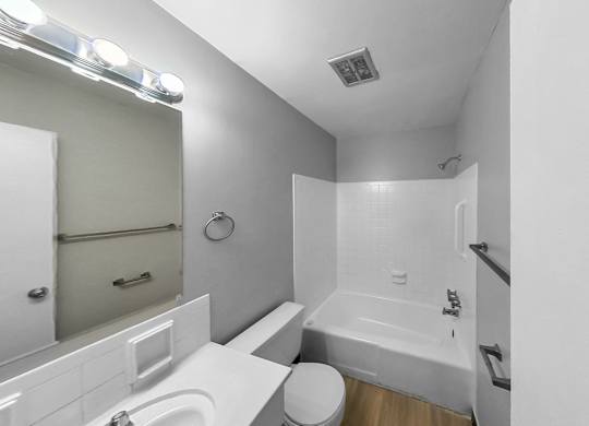 a bathroom with a sink toilet and a bath tub