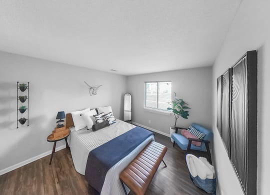 a bedroom with a large bed and a window