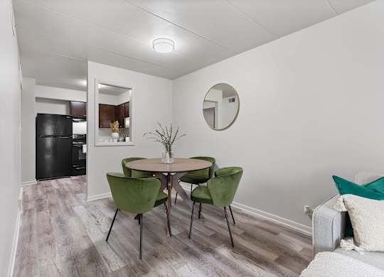 a dining room with a table and chairs