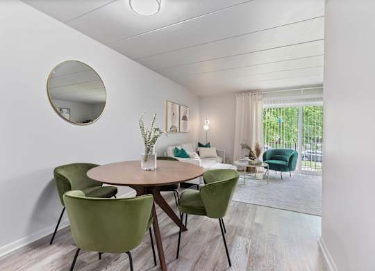a dining room with a table and chairs