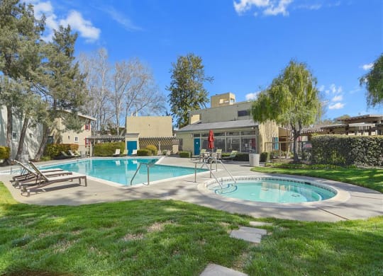green grass surrounding pool and spa at Parkside Apartments, California