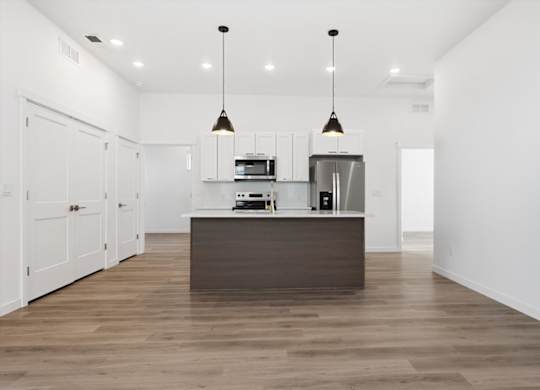 Kitchen with a wooden island at Alante Homes at Spring Run, Caldwell, Idaho