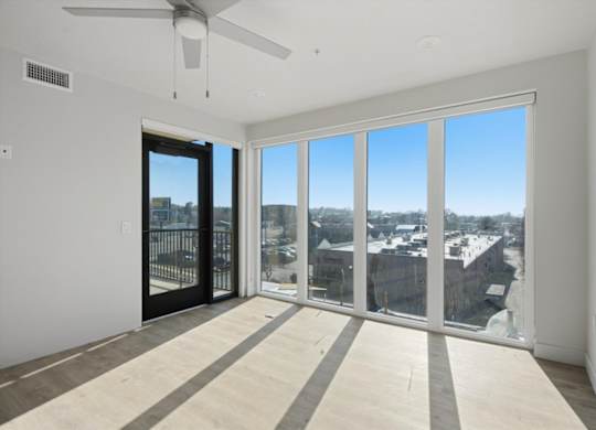Room with oversized windows at Brickside Heights, Utah, 84106