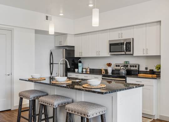 Kitchen with stove top oven at City View St. George, St. George, UT