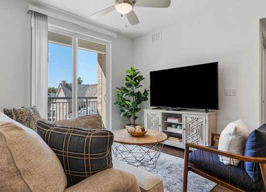 a living room with a couch and a tv at City View St. George Apartments, St George