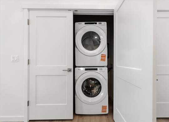 Stack of white washing machines at Alante Homes at Spring Run, Caldwell, ID, 83607