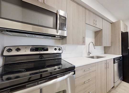 Fully Equipped Kitchen With Modern Appliances at Avia Lofts at Maple Road, Amherst, New York