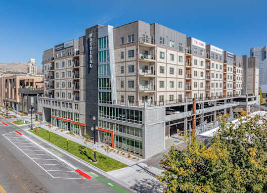 a large building with many windows and a street in front of it at The Revival, Salt Lake City, UT, 84101