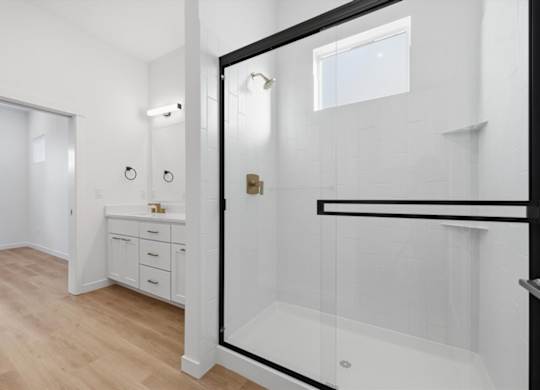 Bathroom with glass separated shower at Alante Homes at Spring Run, Caldwell, Idaho