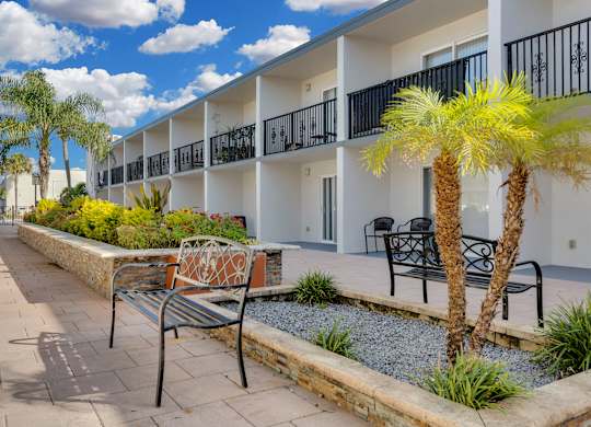Courtyard with bench at Avia Apartments at Reedy Creek, Kissimmee