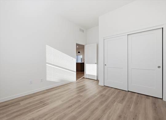 Unfurnished bedroom with wooden floor at Alante Homes at Spring Run, Caldwell, ID