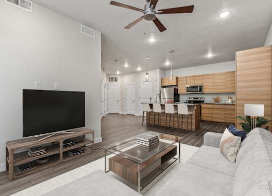 Living Room With TV at The Flats at Riverwoods, Provo