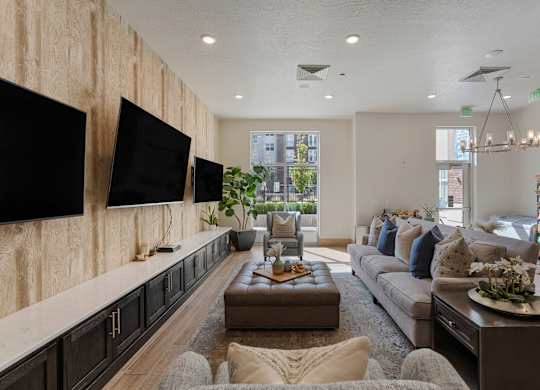 a living room with a large couch and a tv at 200 City View, Provo, UT, 84601