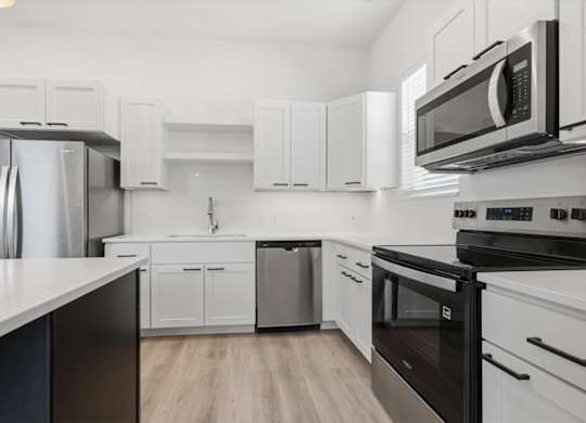 Modern kitchen with stove top oven at Alante Homes at Spring Run, Caldwell, 83607