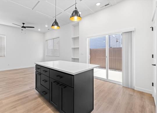 Kitchen with white counter and black cabinet at Alante Homes at Spring Run, Idaho