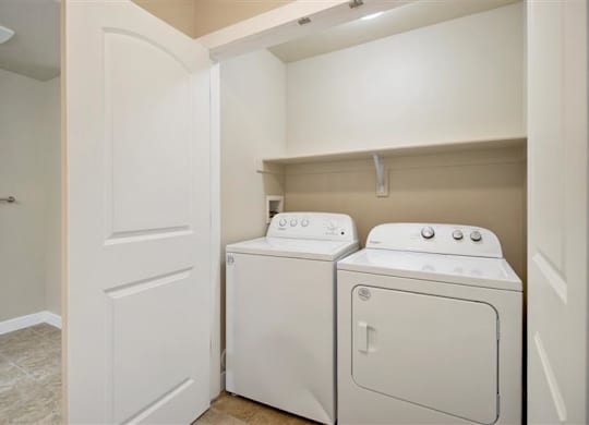 a white washer and dryer in a room at Siena Villas Apartments, Utah