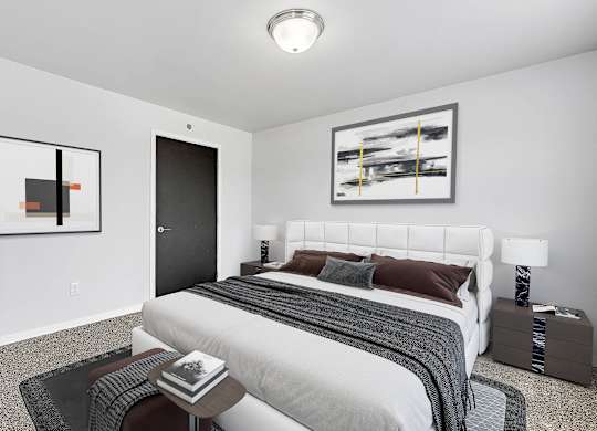 A bedroom with a large bed at Red Rock Apartments, Rapid City, SD