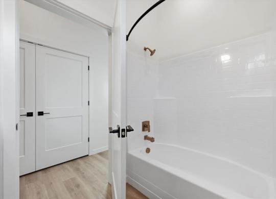 Bathroom with bathtub and shower at Alante Homes at Spring Run, Idaho, 83607