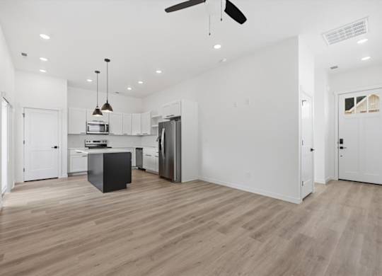 Spacious room with kitchen view at Alante Homes at Spring Run, Caldwell, ID, 83607