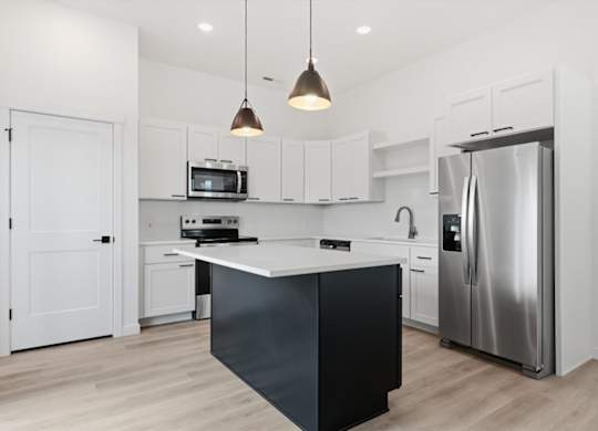 Modern kitchen with white countertop at Alante Homes at Spring Run, Idaho