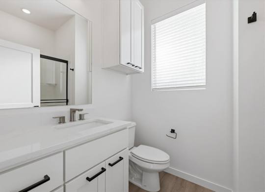 Bathroom with toilet and mirror at Alante Homes at Spring Run, Idaho