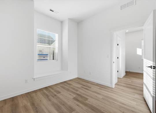 Room with wooden floor at Alante Homes at Spring Run, Idaho