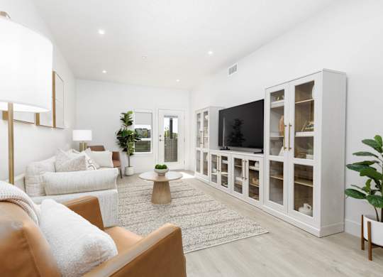 Modern living room with TV at The Vue At Desert Color, St. George, Utah