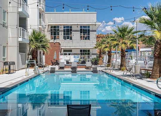 a swimming pool with a building in the background at 605 Place Student Housing & Co-Living, Utah, 84770